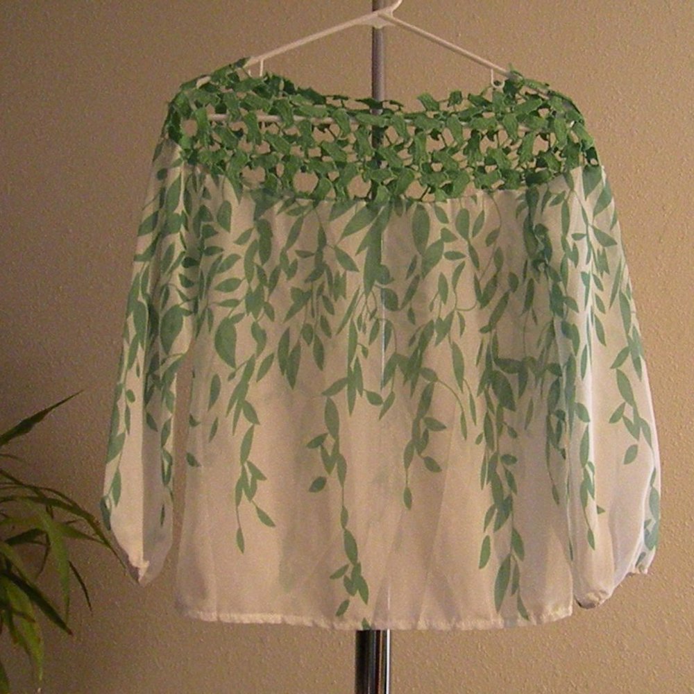 Green off white, sheer top with leaf stem design.